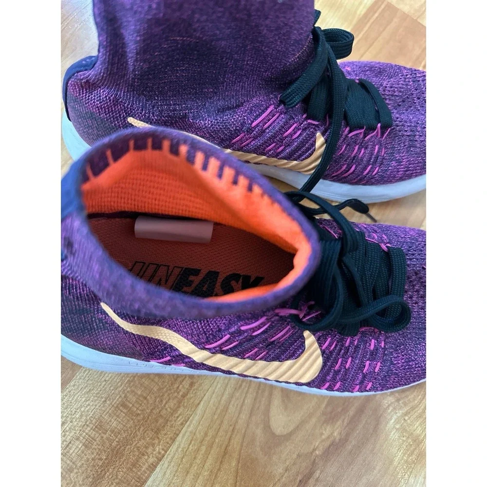 Nike LunarEpic Flyknit running shoes in a purple colorway with an orange swoosh.